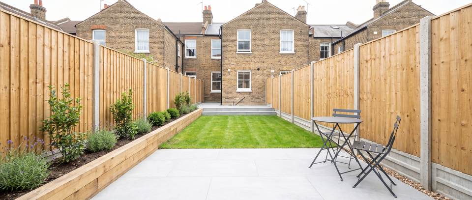 A newly landscaped London garden with a porcelain patio, lawn and featheredge fencing